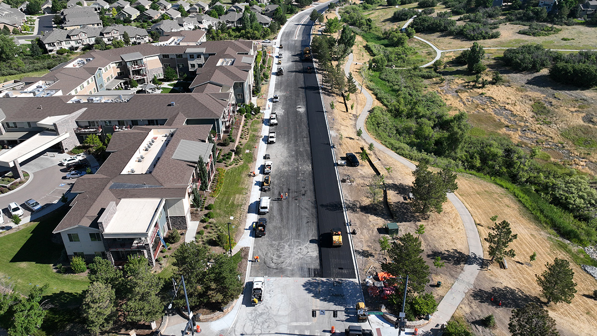 An overview of asphalt paving operations on Monarch Boulevard.